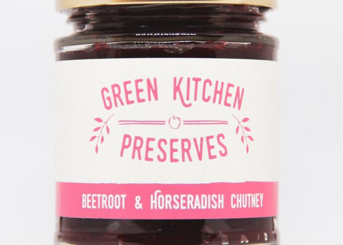 a jar of beetroot & horseradish chutney on a white background