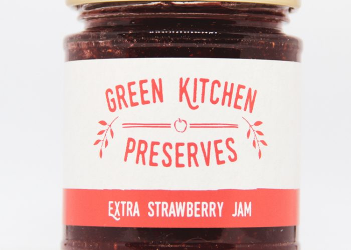 a jar of strawberry jam on a white background